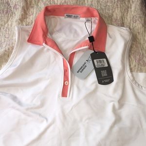 White/coral golf or tennis shirt
